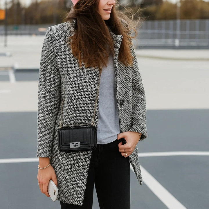 Women's black and white checked long coat with standing collar and button fastening