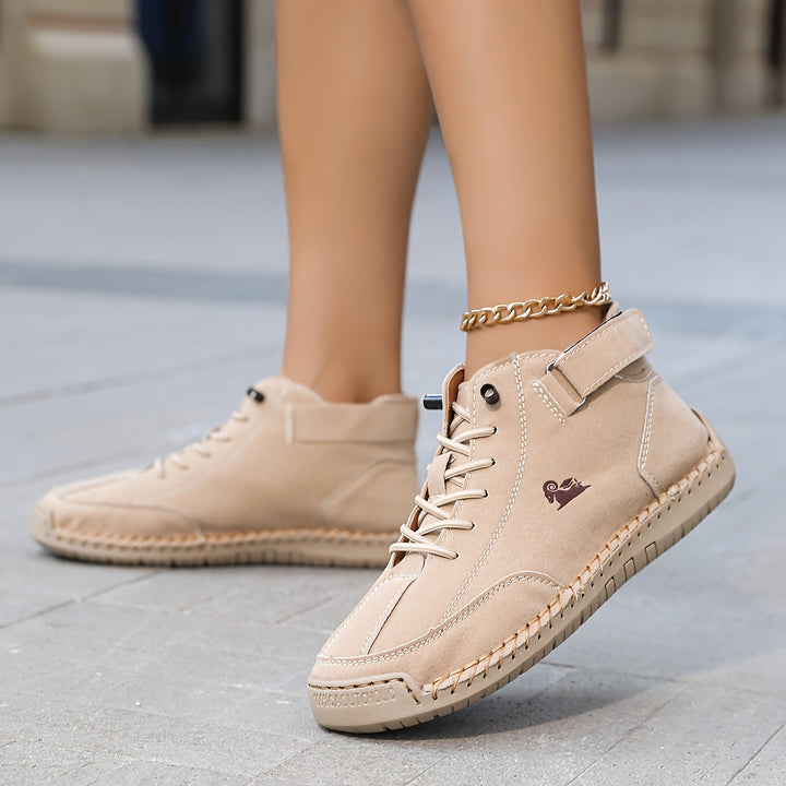 High-top lace-up sneakers with ankle straps, round toes and stitched panel detailing