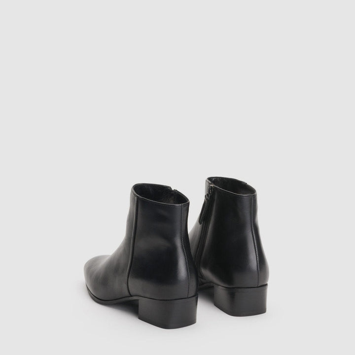 Women's black ankle boots with almond toes and low block heels