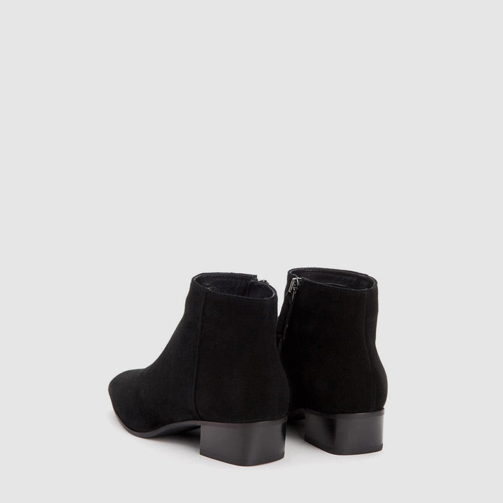 Women's black ankle boot with almond toe and low block heel