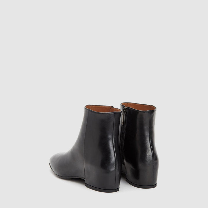 Women's black smooth ankle boot with round toe and low block heel