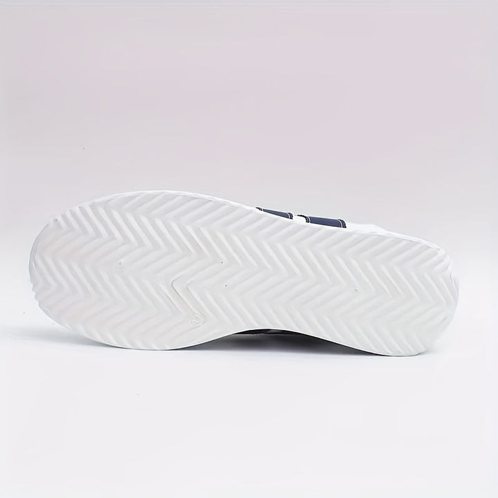 White lace-up trainers with navy side stripes and flat soles