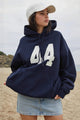 Women's oversized pullover hoodie with hood, number graphic, long sleeves and front pouch pocket