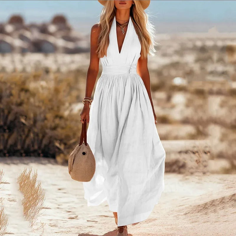 Women's halter maxi dress in brown and white with V-neck, sleeveless cut, and pleated skirt