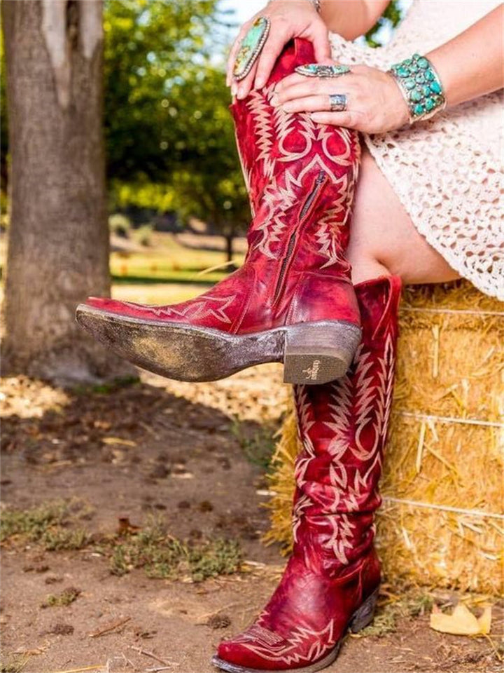 Women's knee-high cowboy boots with pointed toes and embroidered Western shaft detailing