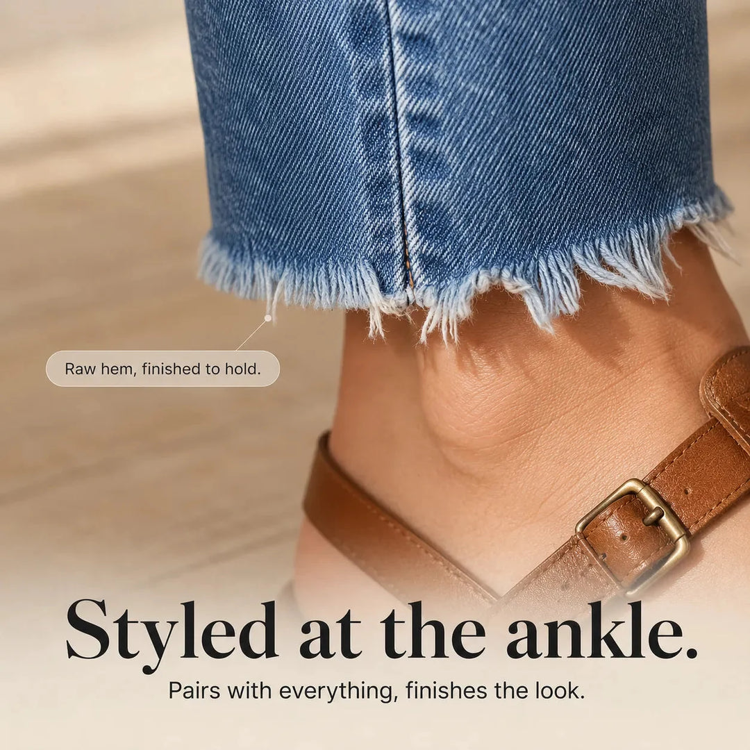 Women's blue distressed straight leg jeans with cropped frayed hems