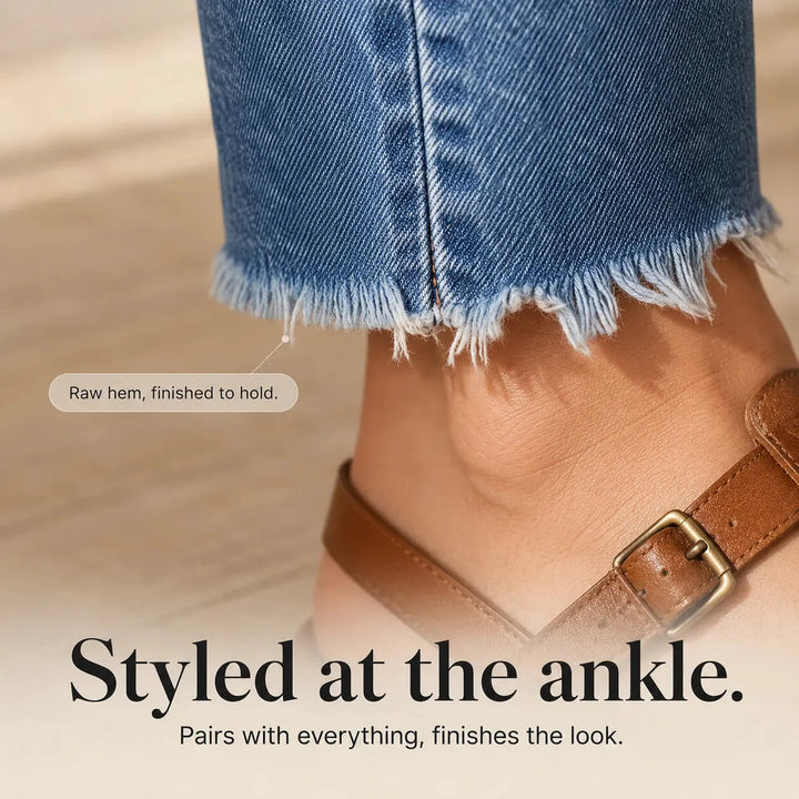 Women's blue distressed straight leg jeans with cropped frayed hems