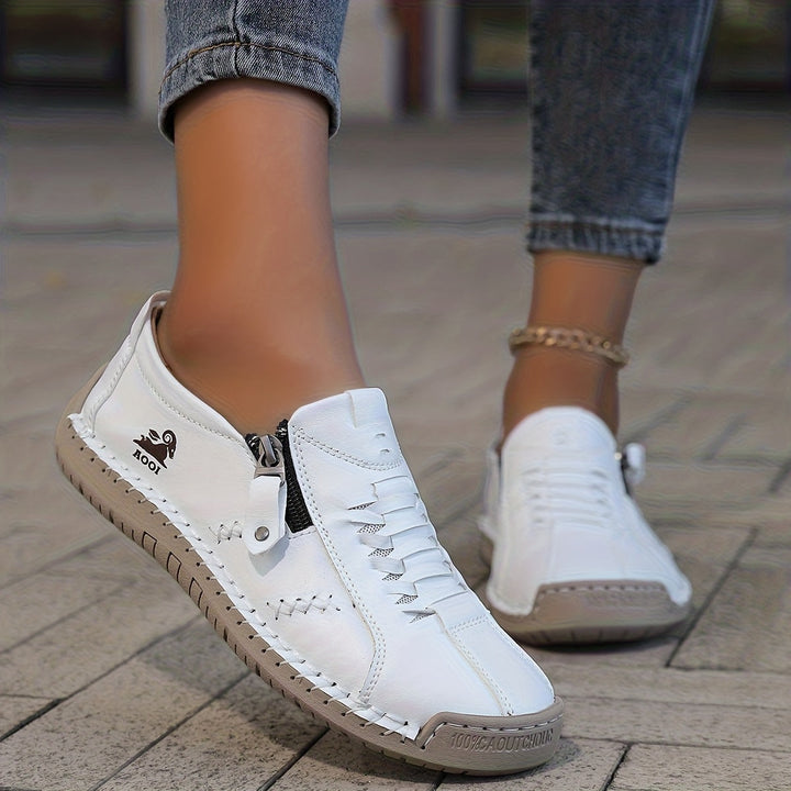 Low-top lace-up trainers with side zip and flat textured soles