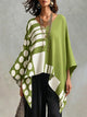 Women's oversized batwing sleeve top with polka-dot print in black and white, and green and white versions
