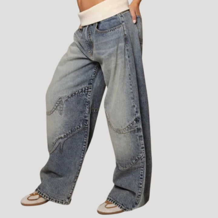 Women's light blue low-rise baggy jeans with curved seam panels