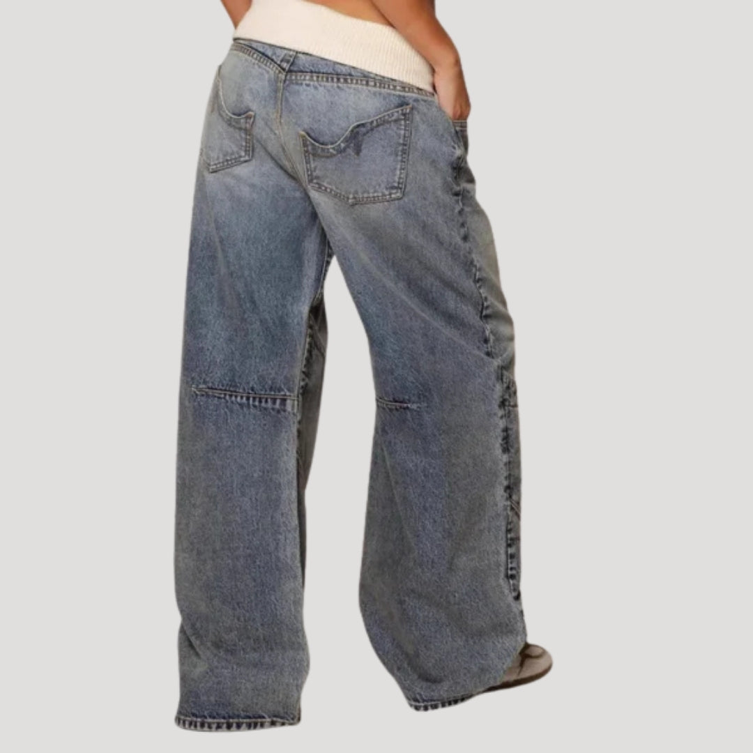 Women's light blue low-rise baggy jeans with curved seam panels