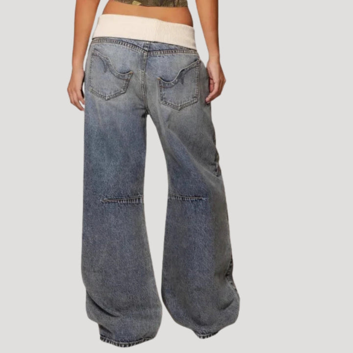 Women's light blue low-rise baggy jeans with curved seam panels