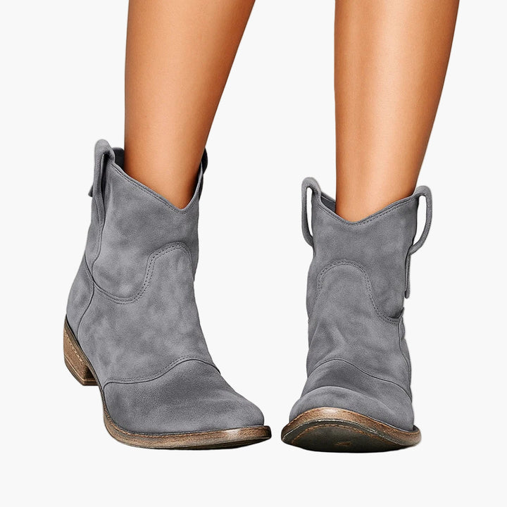 Women's western boots with pull tabs and stitched panels