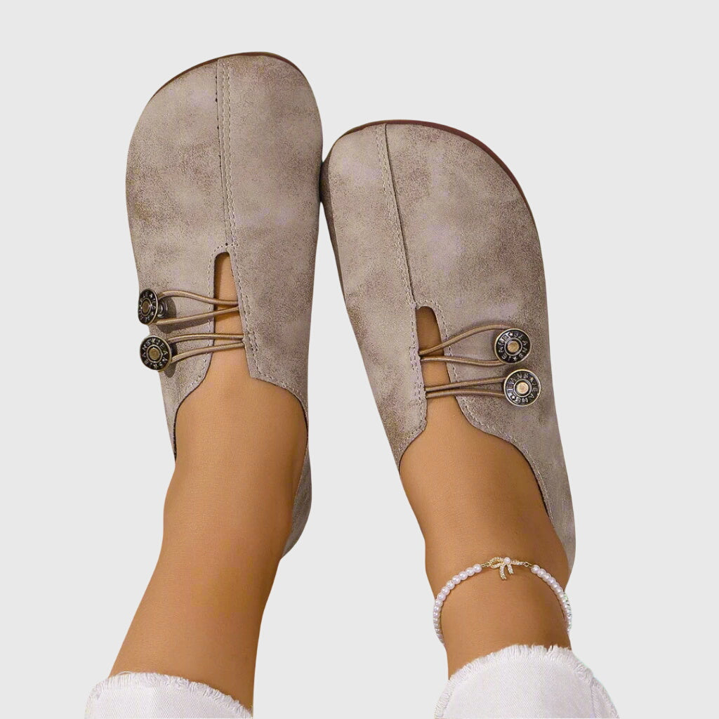 Women's lace-up ballet flats with round toes and button details