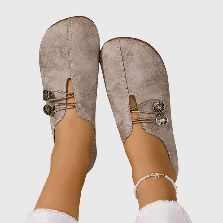 Women's lace-up ballet flats with round toes and button details