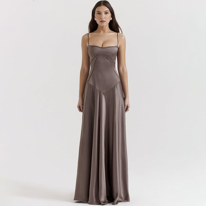 Women's black maxi dress with cowl neckline and cami straps, showing full-length floor skirt and back tie detail