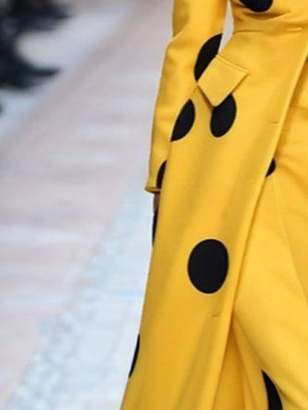 Yellow long coat with large black polka dots
