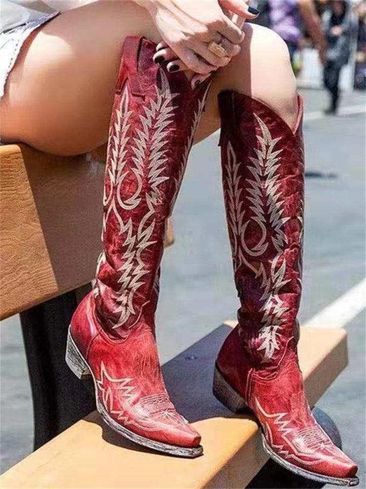 Women's knee-high cowboy boots with pointed toes and embroidered Western shaft detailing