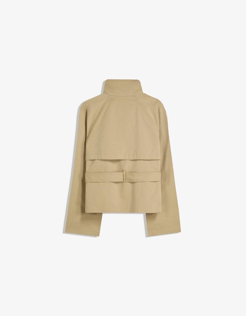 Women's short trench jacket with high collar, buttons, belt and shoulder tabs