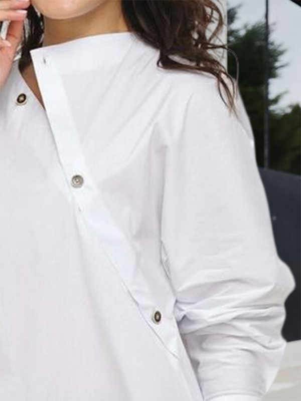 Women's white asymmetric buttoned blouse with mandarin collar and long sleeves