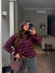 Women's burgundy crew-neck sweater with silver stud detailing and long sleeves