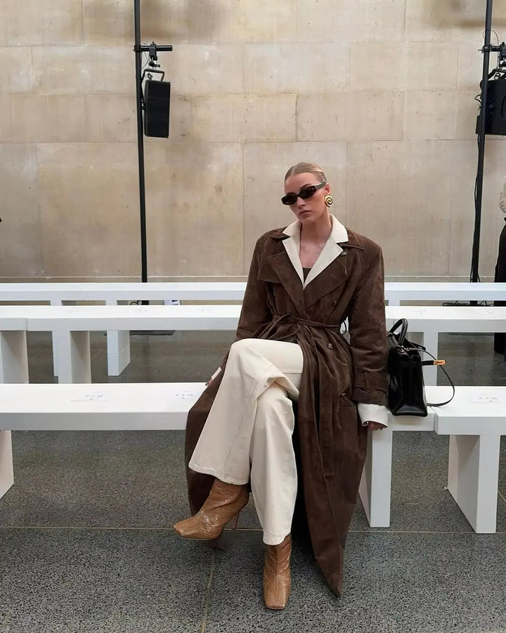 Women's brown full-length trench coat with contrast lapels and waist belt