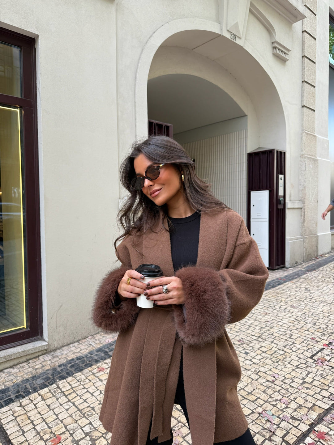 Women's brown long coat with tie belt and fur cuffs