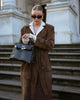 Women's brown full-length trench coat with contrast lapels and waist belt