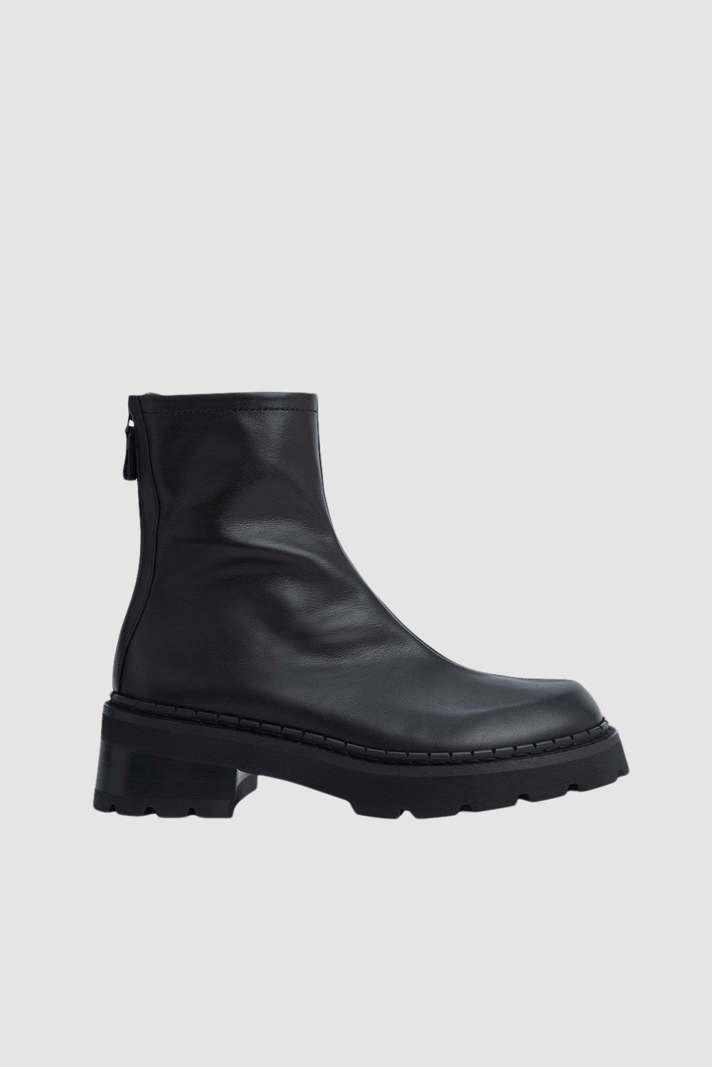 Black ankle boots with chunky block heels and lug soles