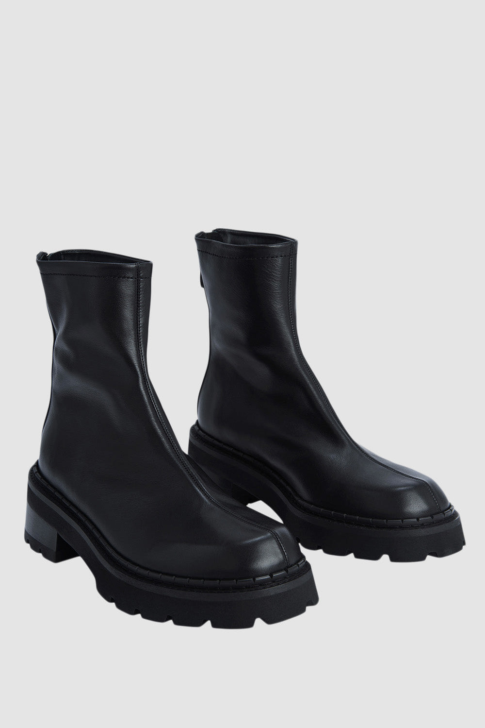 Black ankle boots with chunky block heels and lug soles