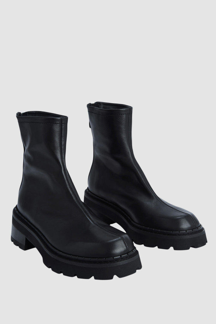 Black ankle boots with chunky block heels and lug soles