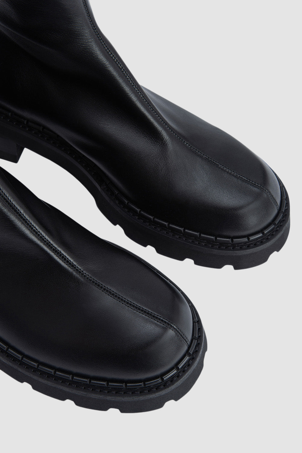 Black ankle boots with chunky block heels and lug soles