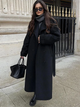 Women's long belted double-breasted trench coat with notched lapel