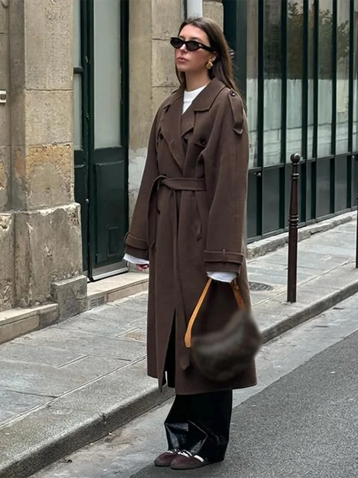 Women's long belted double-breasted trench coat with notched lapel