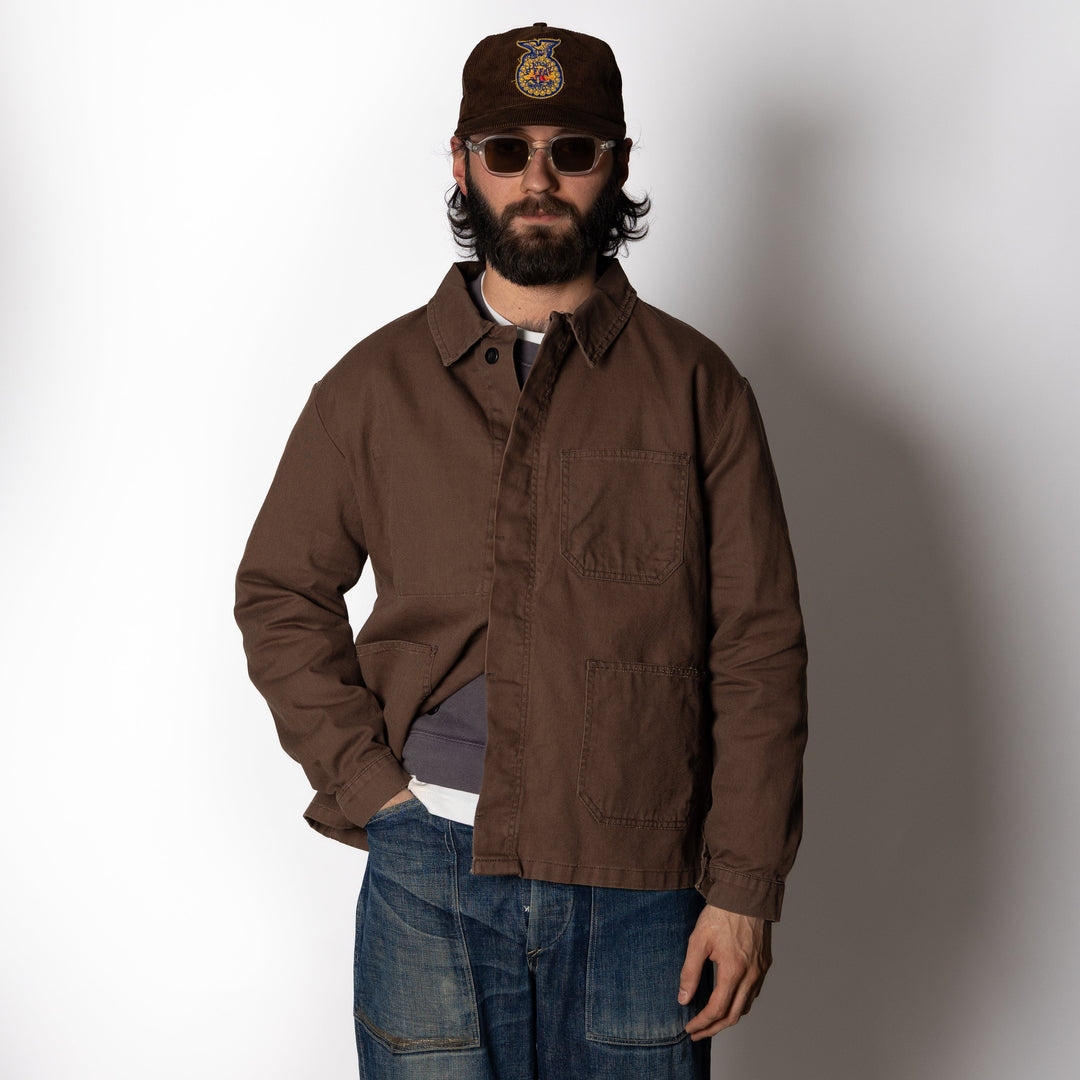 Men's brown utility jacket with button front and four patch pockets