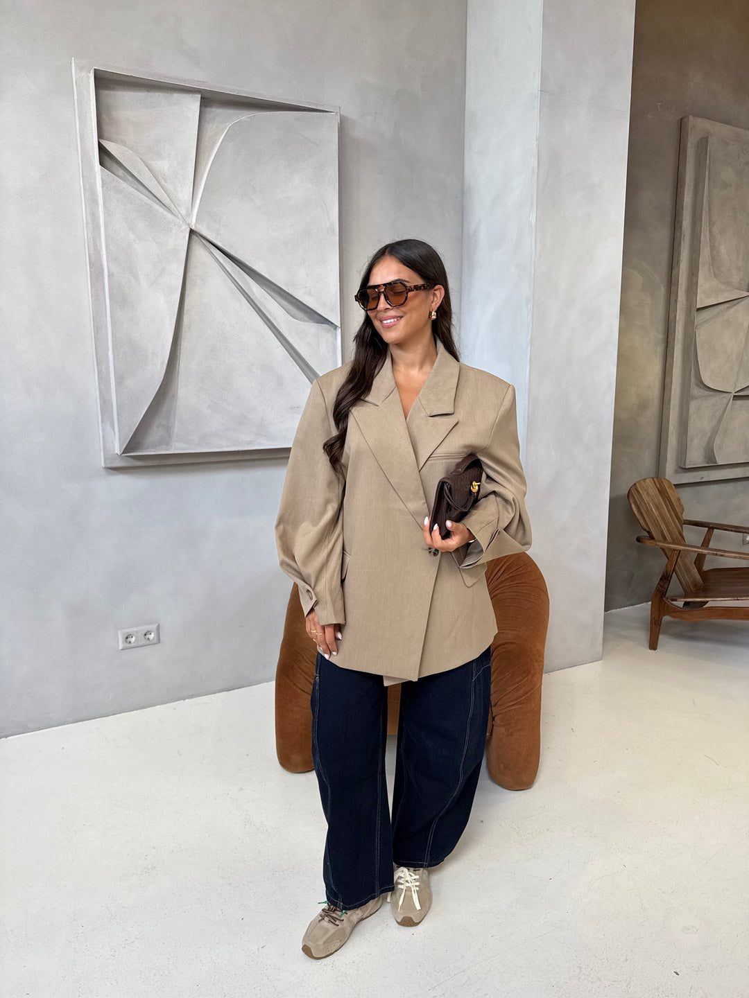 Women's beige blazer with notched lapels and button cuffs