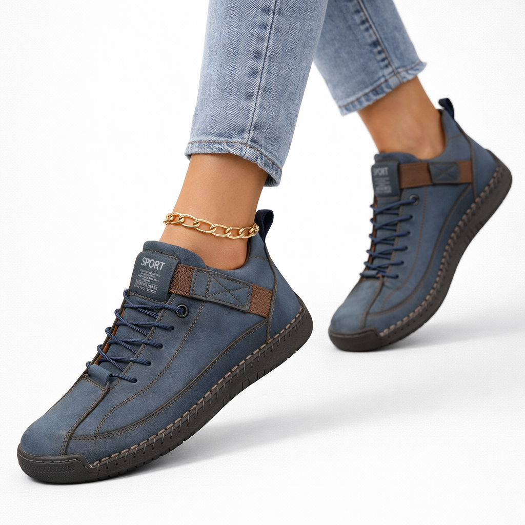 Women's low-top lace-up sneakers with stitched panels, strap detail and flat textured soles