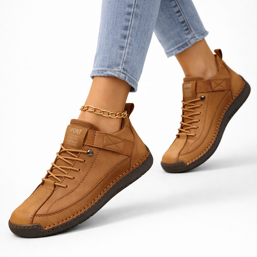 Women's low-top lace-up sneakers with stitched panels, strap detail and flat textured soles