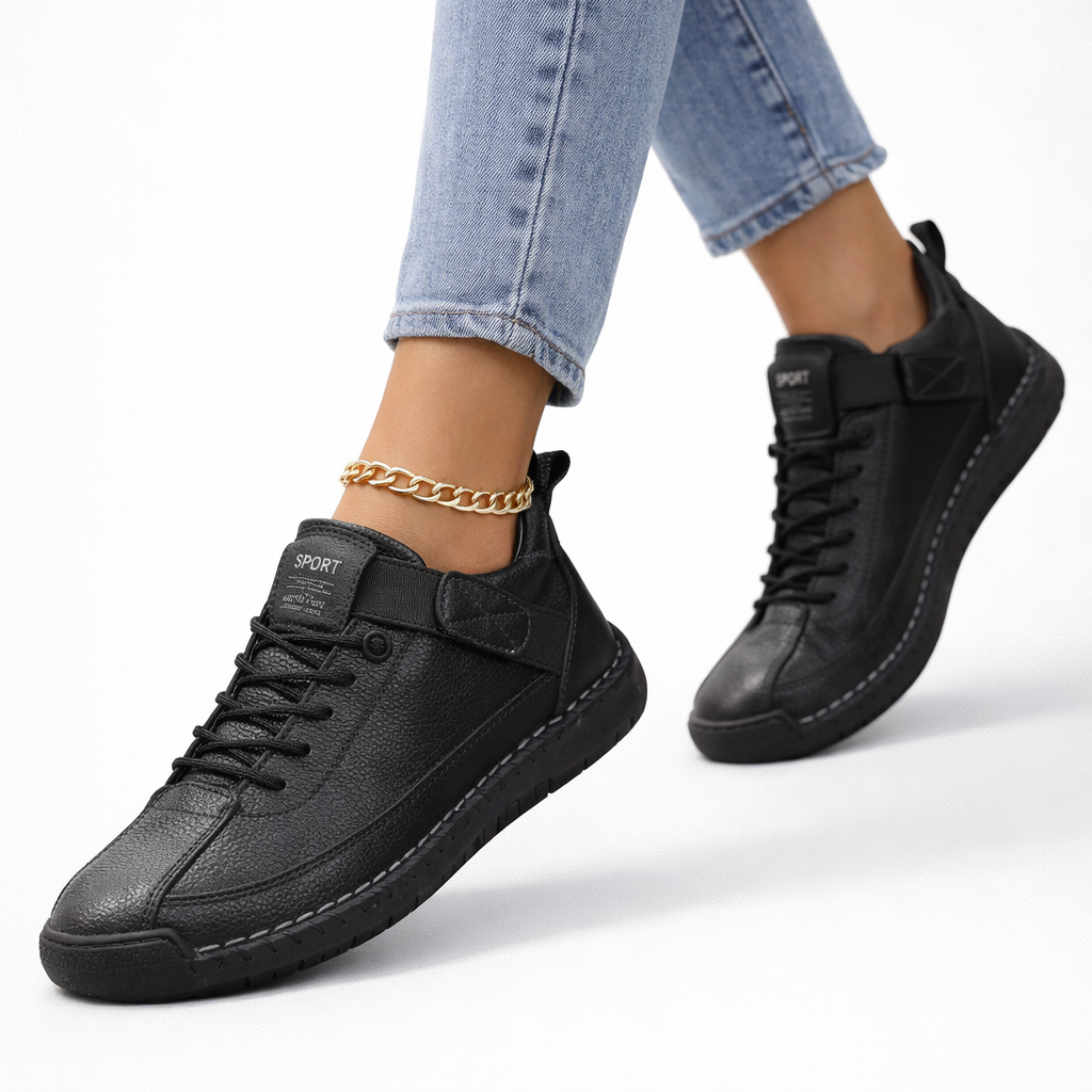 Women's low-top lace-up sneakers with stitched panels, strap detail and flat textured soles