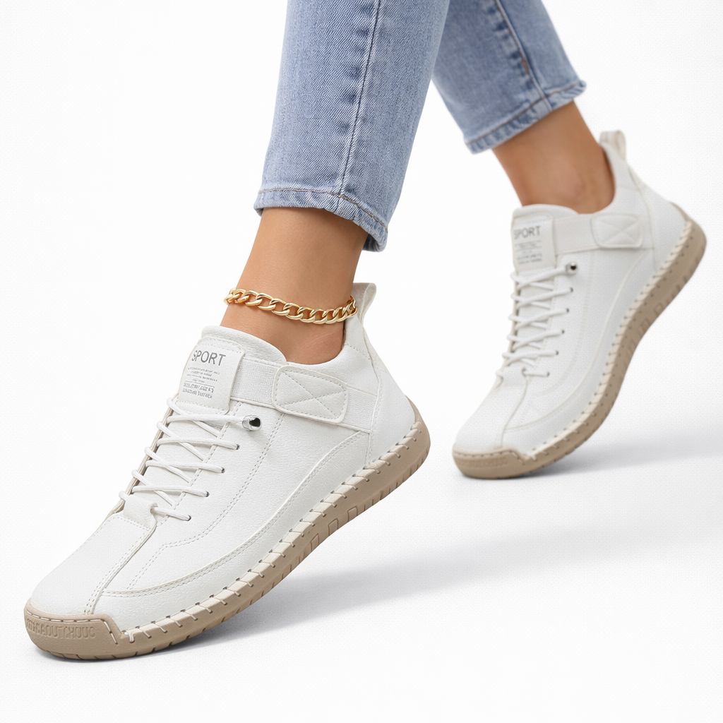 Women's low-top lace-up sneakers with stitched panels, strap detail and flat textured soles