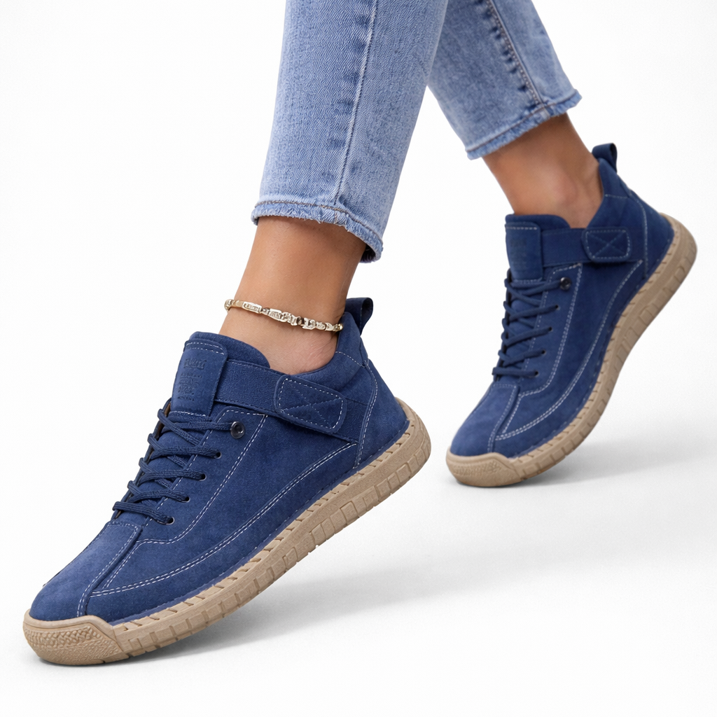 Women's low-top lace-up sneakers with stitched panels, strap detail and flat textured soles