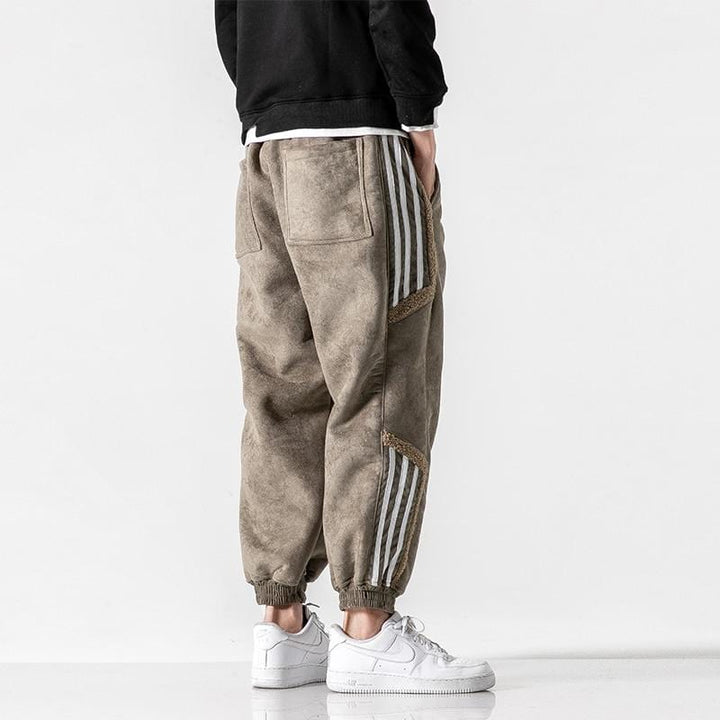 Fleece jogger pants with striped side panels and ribbed cuffs