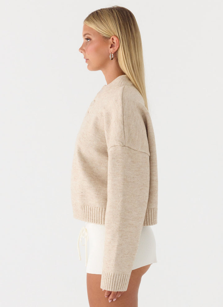 Women's beige button-up mock neck jumper with long sleeves and ribbed trims