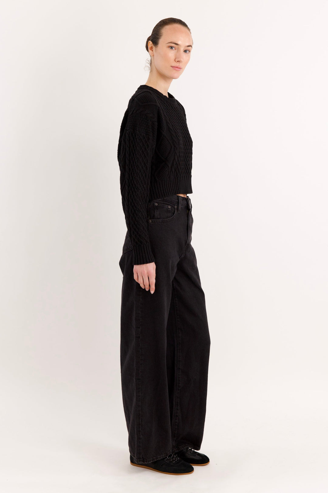 Women's cropped cable knit sweater with crew neckline and long sleeves