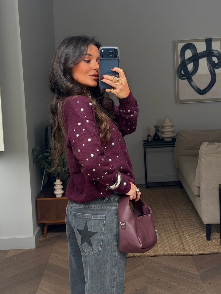 Women's burgundy crew-neck sweater with silver stud detailing and long sleeves