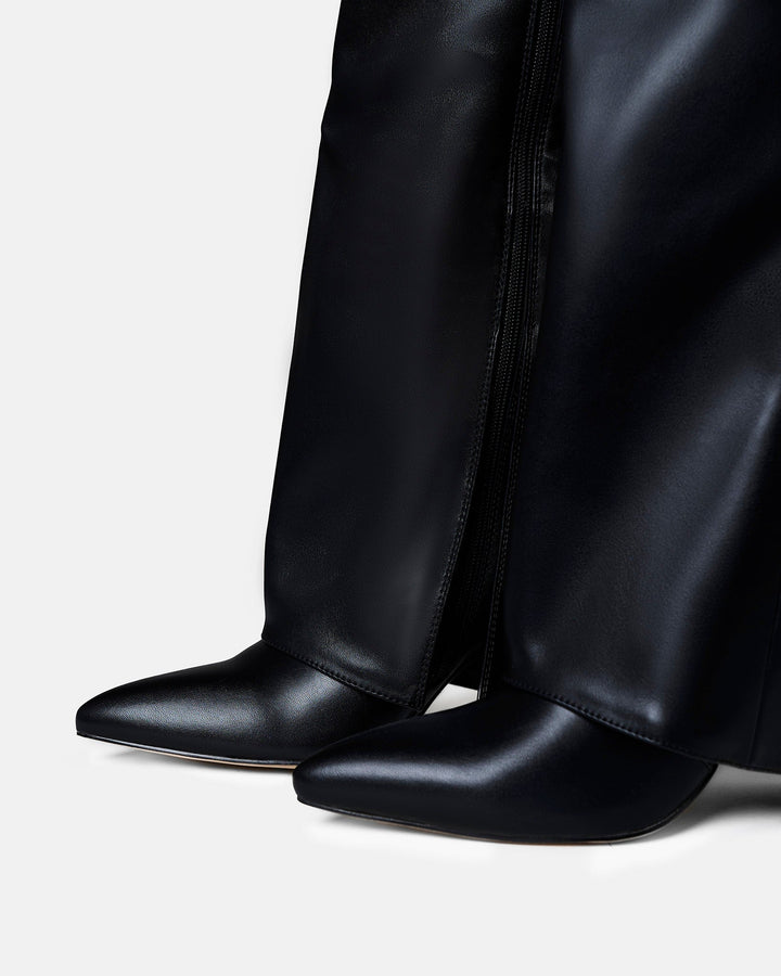 Women's black knee-high boots with pointed toes, low heels and buckle straps