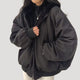 Women's padded jacket with high collar, zip front and flap pockets