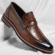 Men's polished penny loafers with rounded toes, low heels and layered soles
