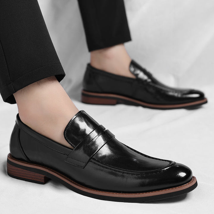 Men's polished penny loafers with rounded toes, low heels and layered soles