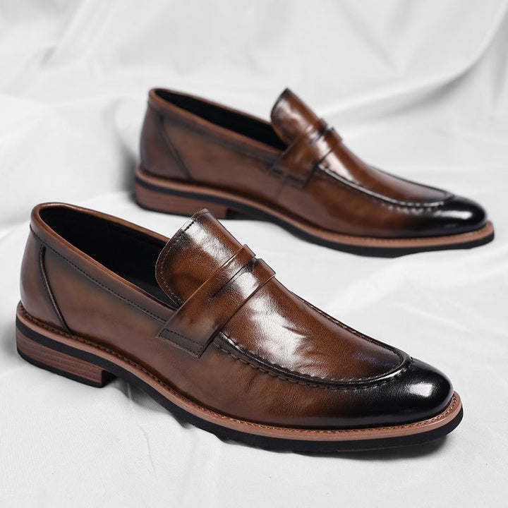 Men's polished penny loafers with rounded toes, low heels and layered soles